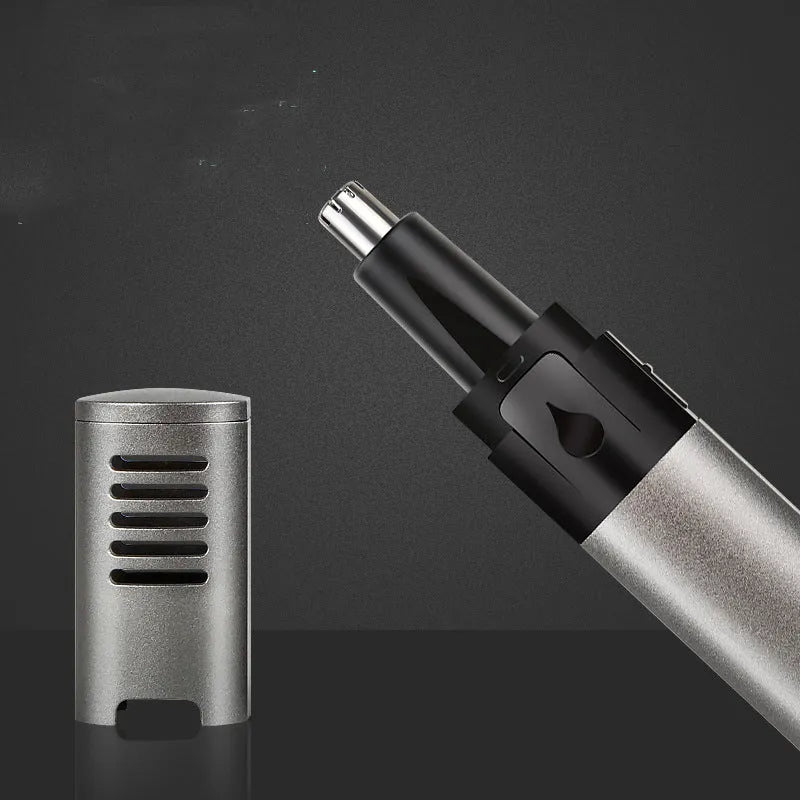 Silver grey metal aluminium tube USB rechargeable nose hair trimmer on clean background
