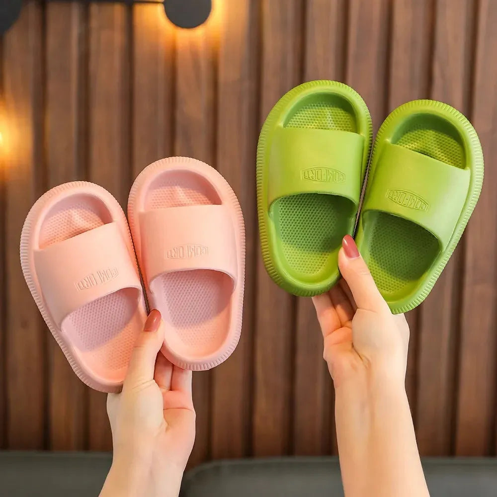 Children's EVA literal slippers with injection moulded soles in mixed colours showing non-slip wear-resistant design