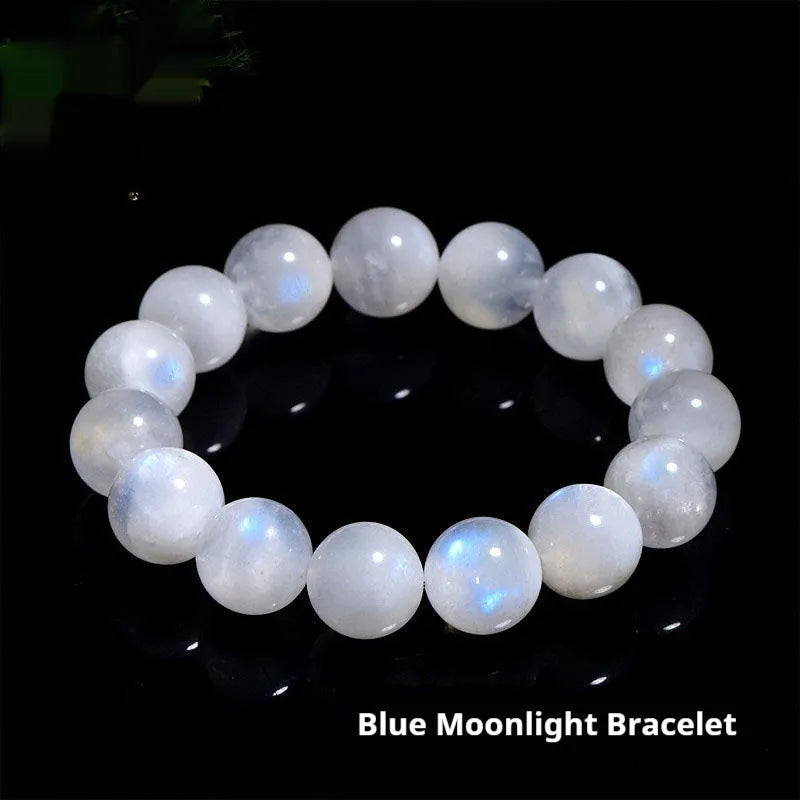 Natural blue moonlight round moonstone bead bracelet on a white background showing polished spherical beads.