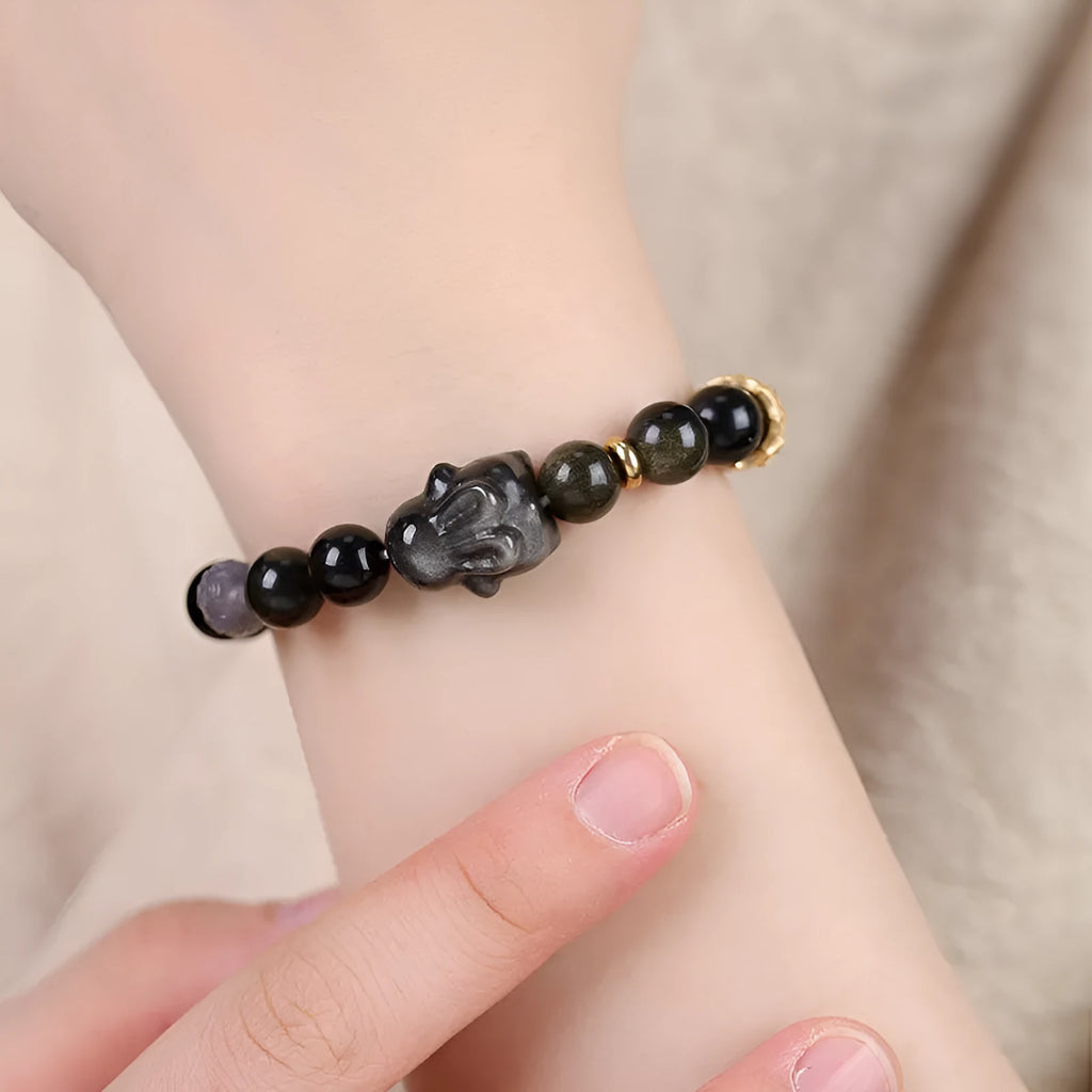 Handmade lying rabbit obsidian bracelet with Jin Yaoshi beads and brass details in national style.