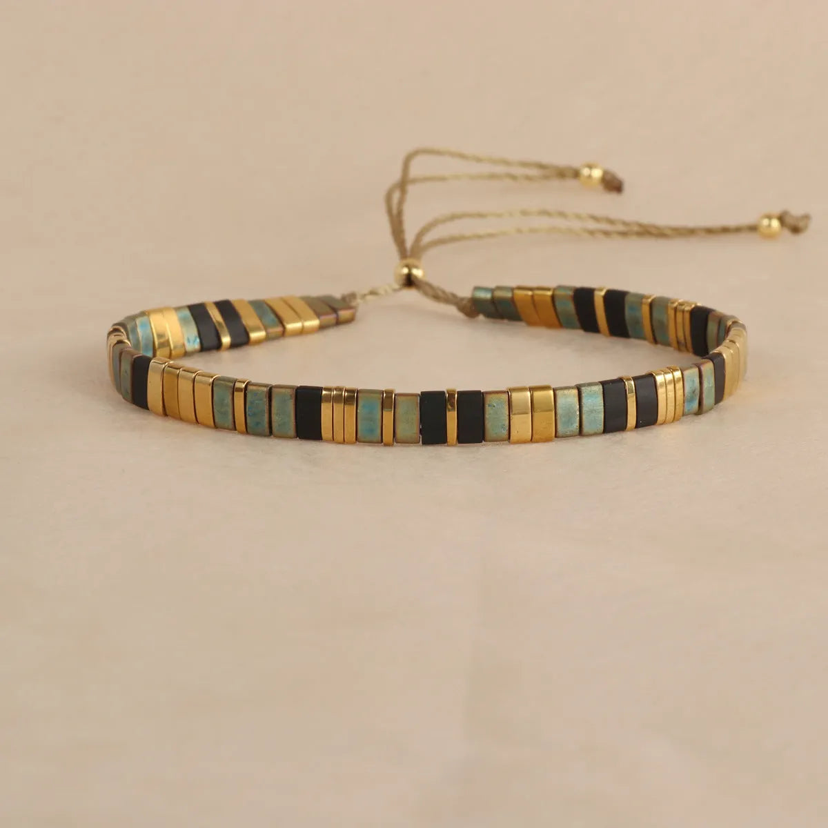 Geometric pull bead glass bracelet in multiple colour options on wrist