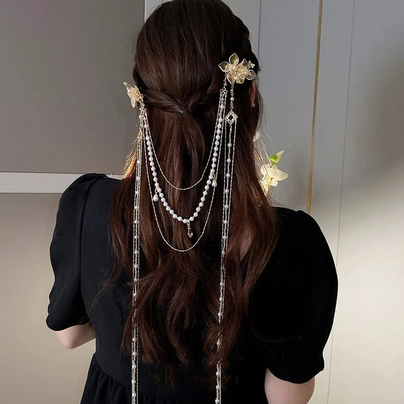 Gold women's hairpin with pearl, diamond and flower design featuring long tassel decoration