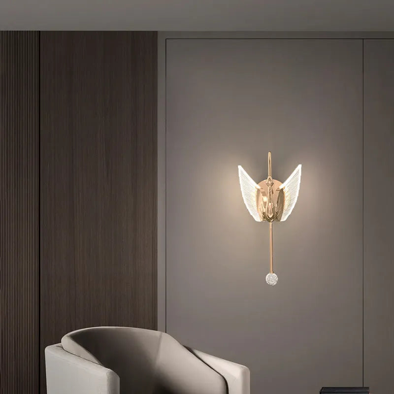 Gold swan-shaped LED wall lamp with acrylic shade for modern bedroom bedside lighting