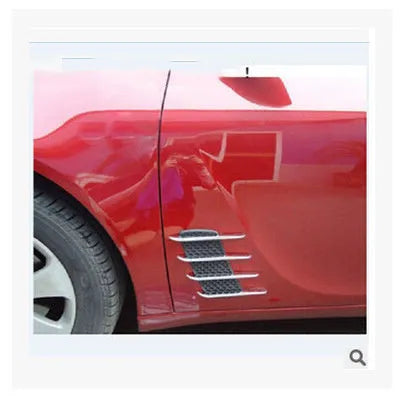 Black car body sticker with shark gill air outlet design and electroplated finish on a vehicle door