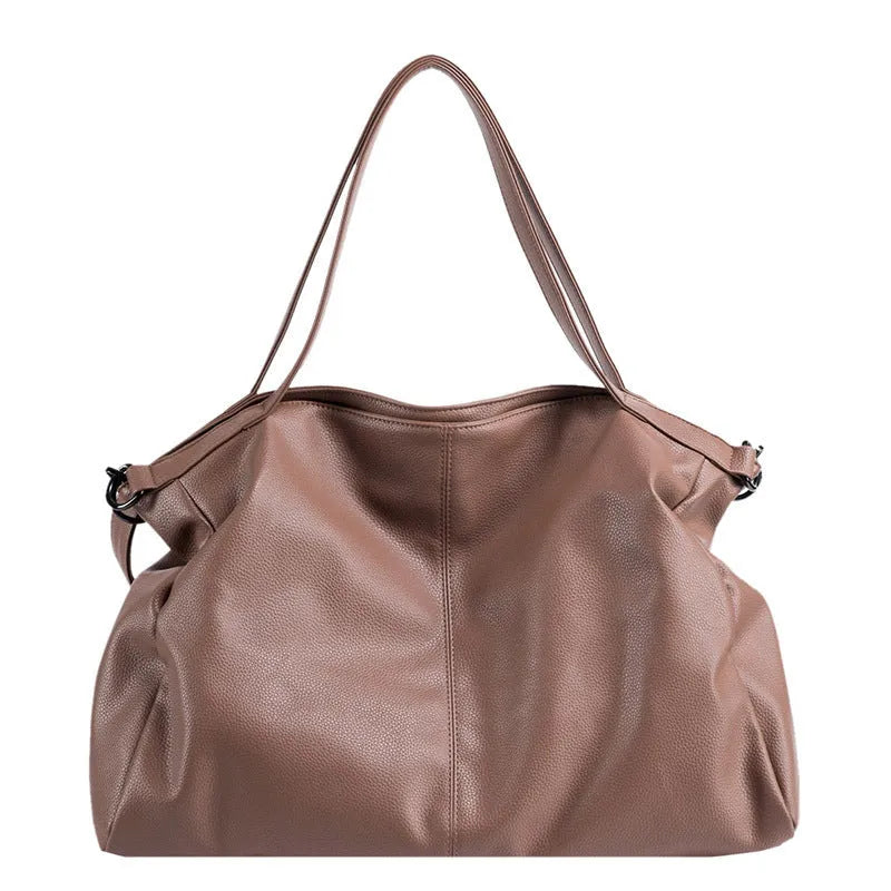 Large horizontal PU messenger bag with soft surface and shoulder strap in black colour