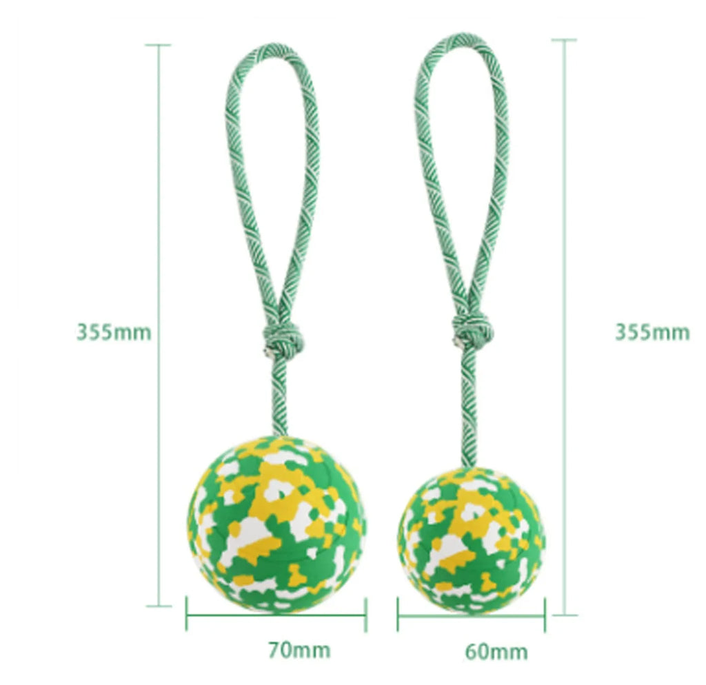 Natural rubber dog ball attached to nylon rope for interactive fetch and tug games