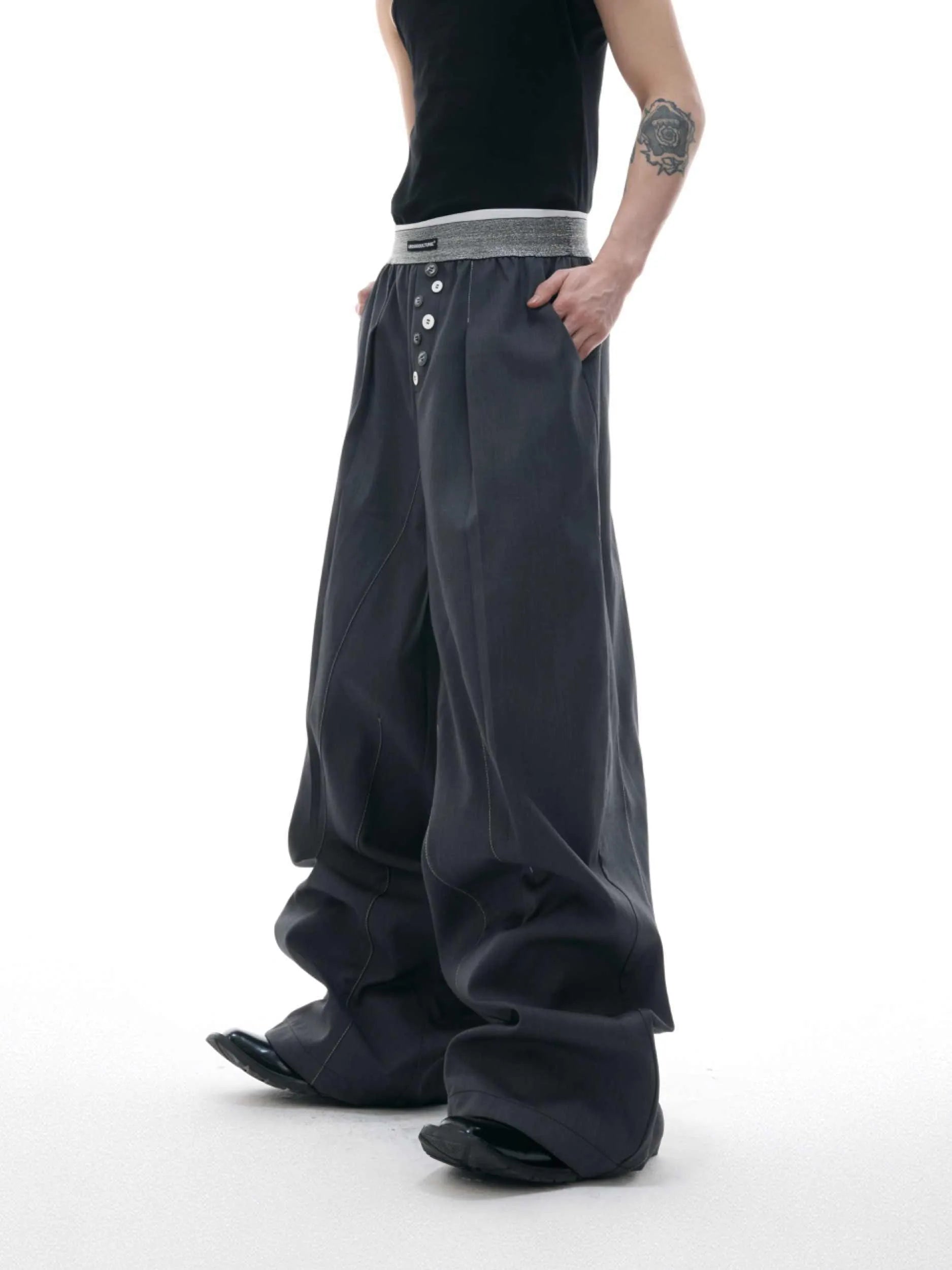 Man's black high-waisted straight-leg casual trousers with a button fly.