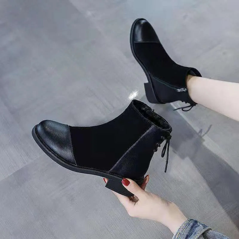 Black knee-high women's Martin boots with a side zipper, round toe, and bow detail.