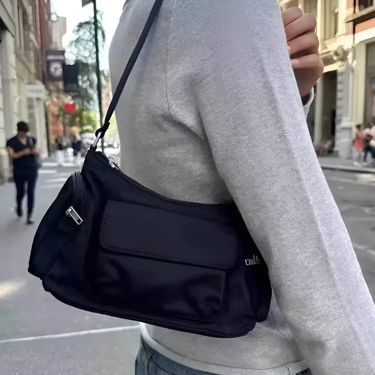 Black lightweight women's shoulder bag with double pockets and side line detail