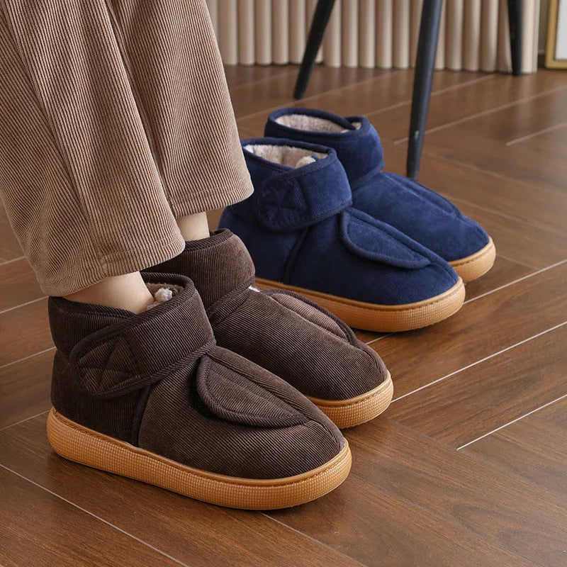 Large opening warm boots with anti-slip rubber soles, unisex slip-on design, plush upper and faux fur lining in black