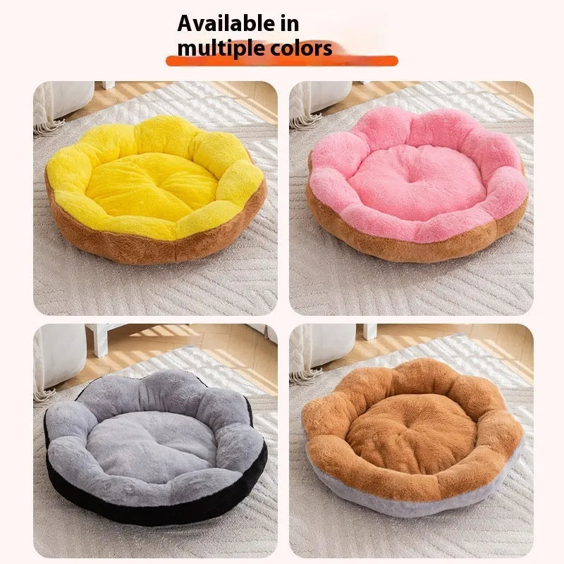 A round, thick plush cat bed with a removable cover shown in a two-tone colour, placed next to a cat toy.