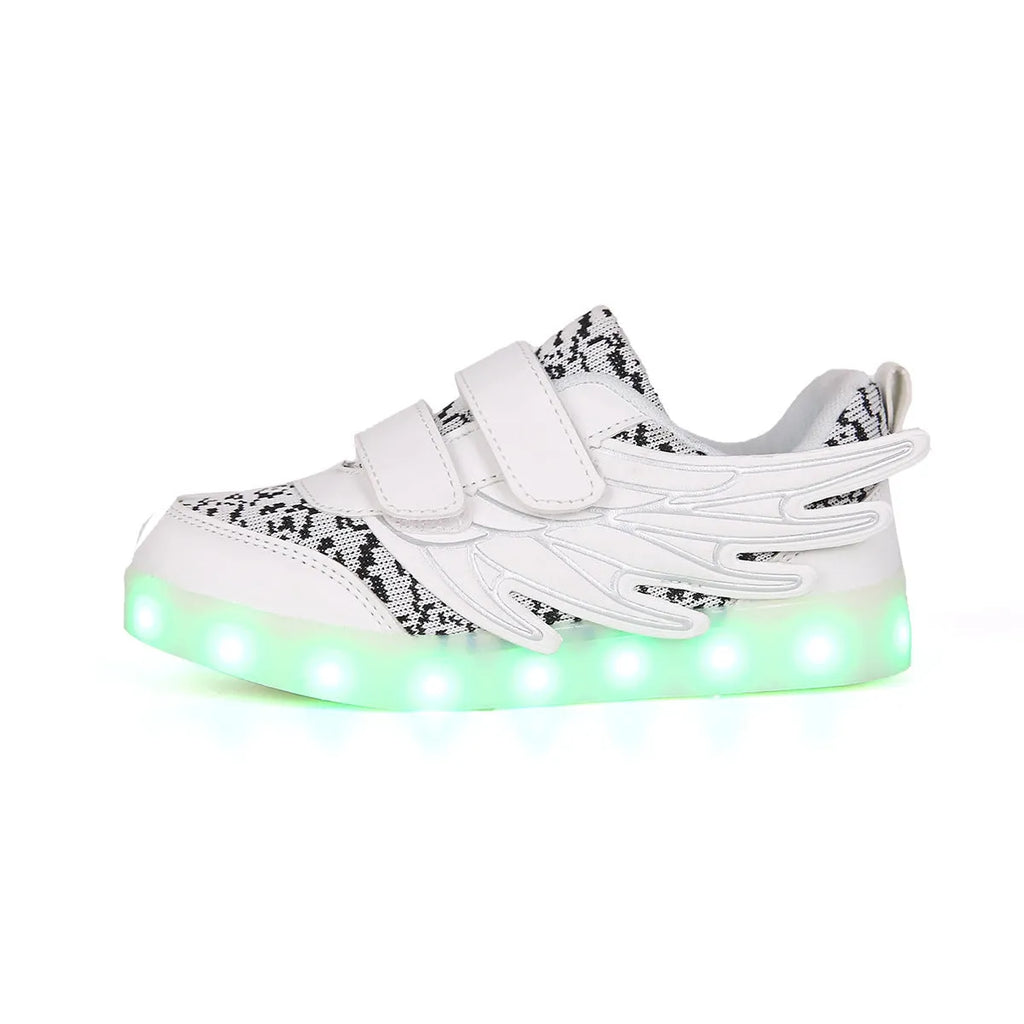Children's plum red and white LED light-up sneakers showing flashing soles and USB charging cable.