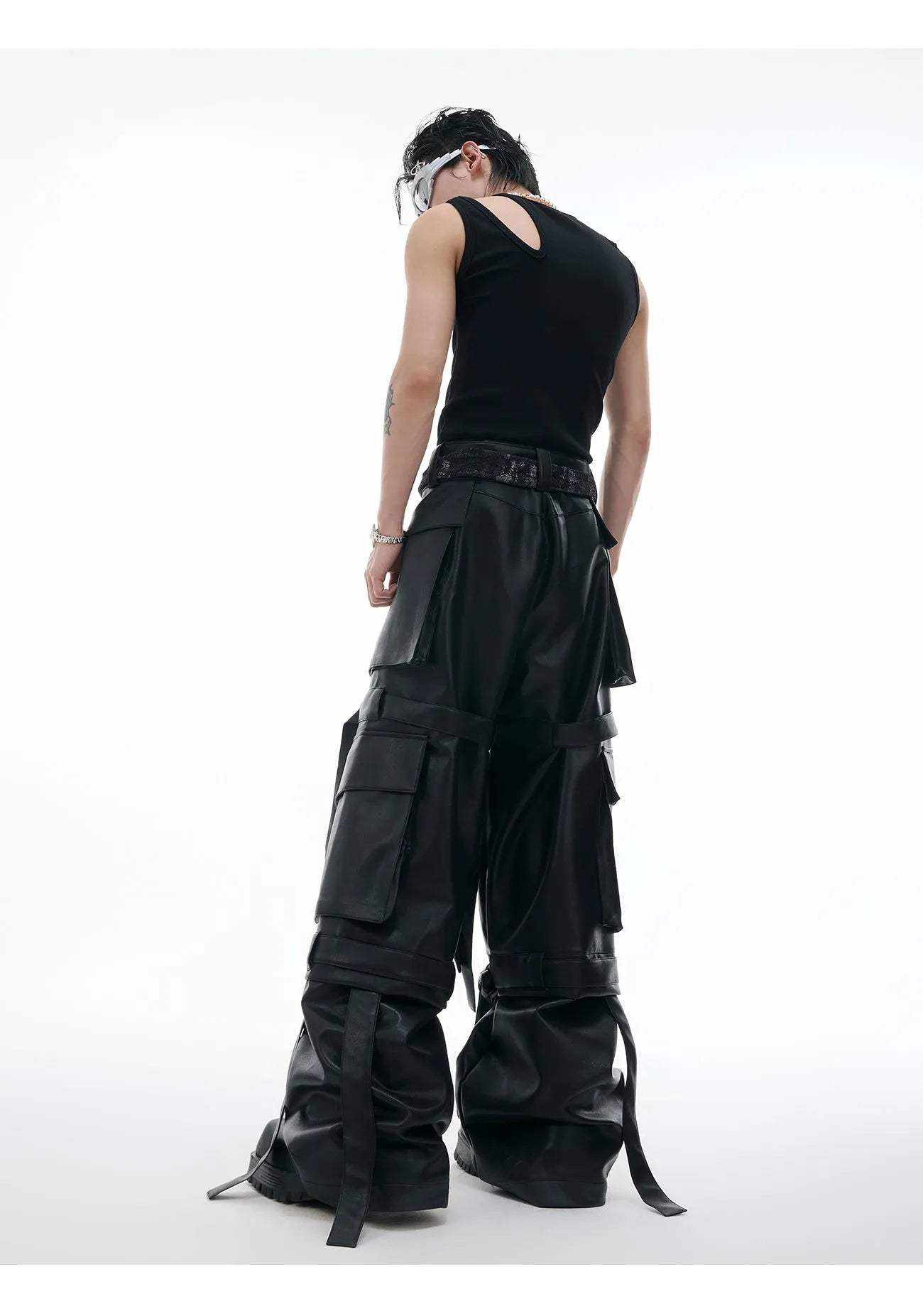 Black loose fit leather pants with multiple pockets and quilted stitching detail