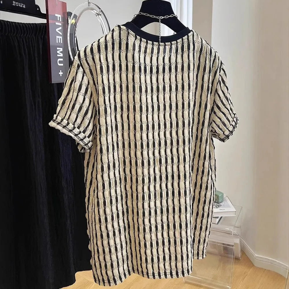 Black men's loose-fitting striped short sleeve pullover top made from silk and linen blend.