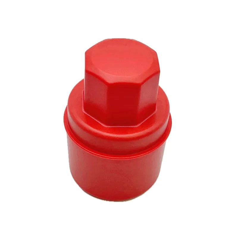 Black and red tyre polishing sponge brushes with protective lids on a white background