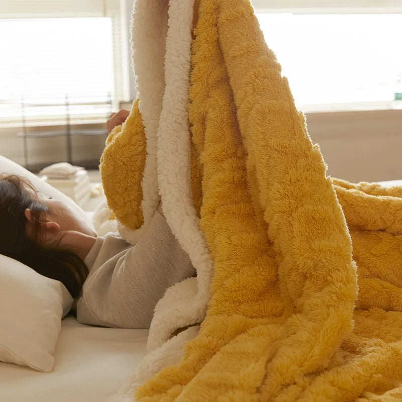 Polyester thermal flannel blanket in beige colour, folded to show texture, for winter bed use.
