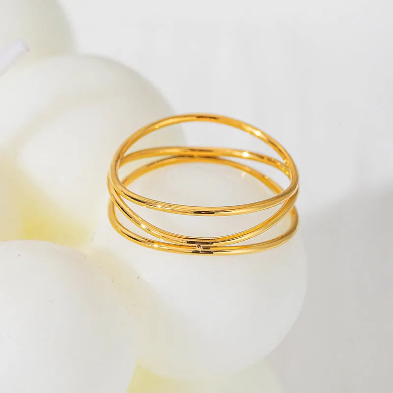 Gold electroplated titanium steel ring with three-layer geometric coiled line design