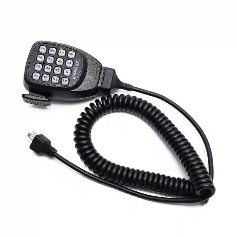 Jianwu TM series vehicular marine VHF transceiver with hand microphone and car antenna on table