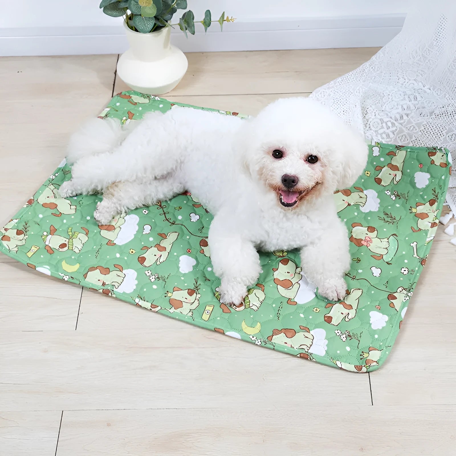 Reusable cloth pet urine pad with colourful animal print and waterproof backing.