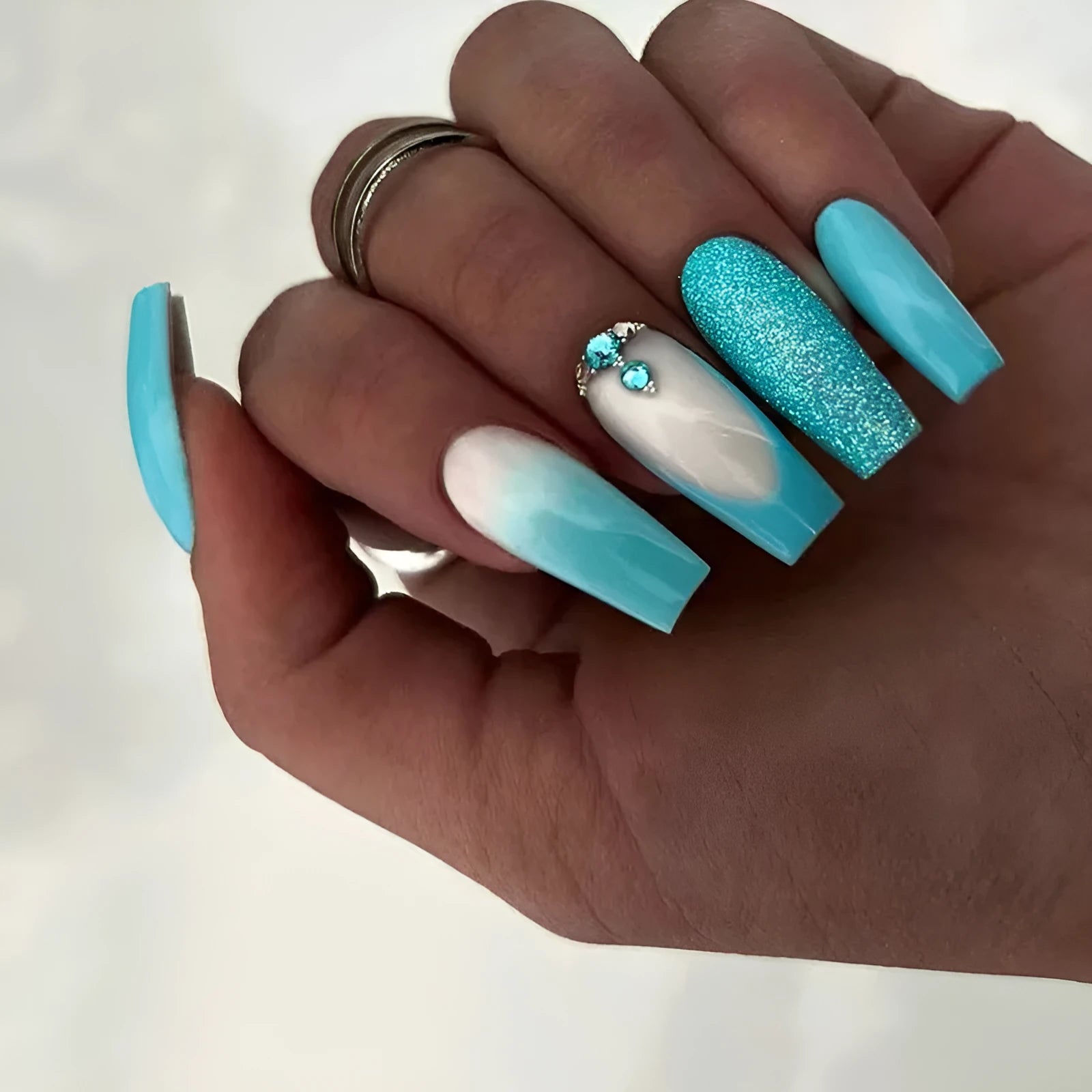 Long ballet false nails in smart blue diamond colour with adhesive glue bottle