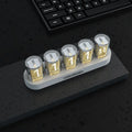 RGB Luminotron LED digital clock showing colourful display on desktop