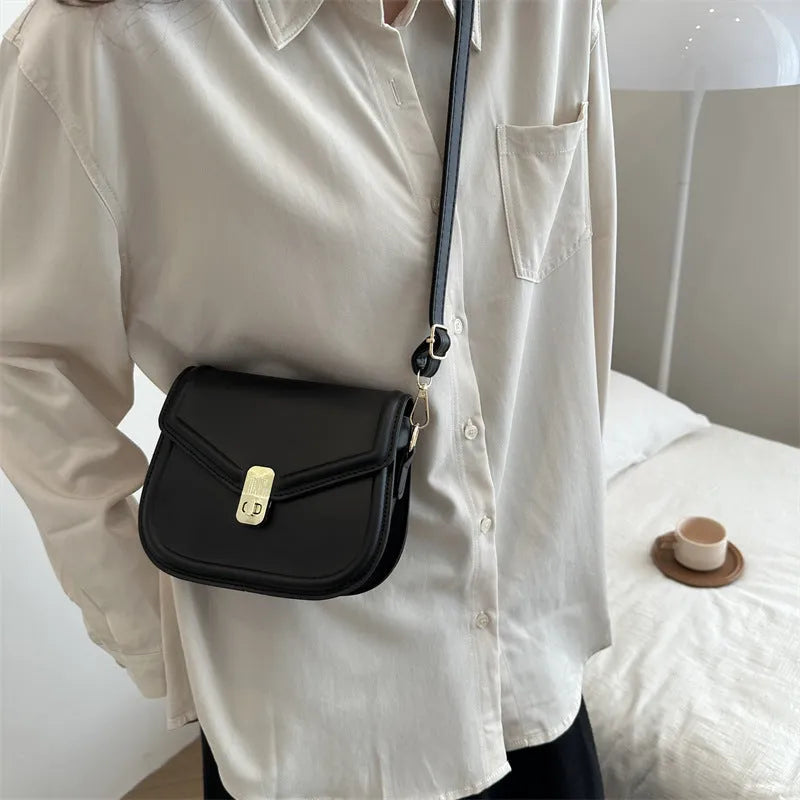 Soft, textured PU clamshell messenger bag in a horizontal rectangle shape.