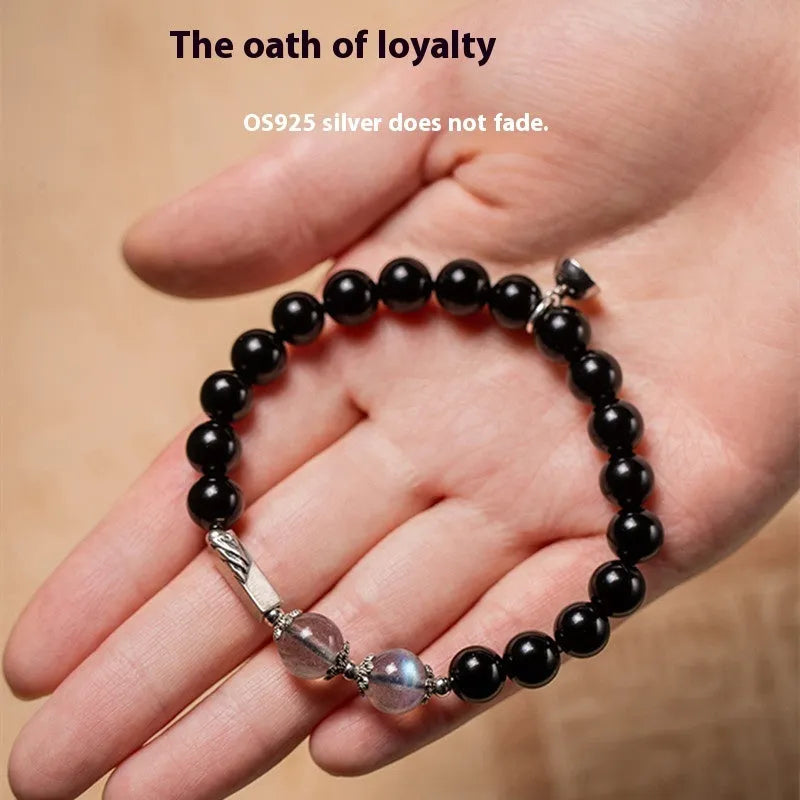 Obsidian couple bracelet DIY kit with 8mm and 10mm black beads and cord for assembly.