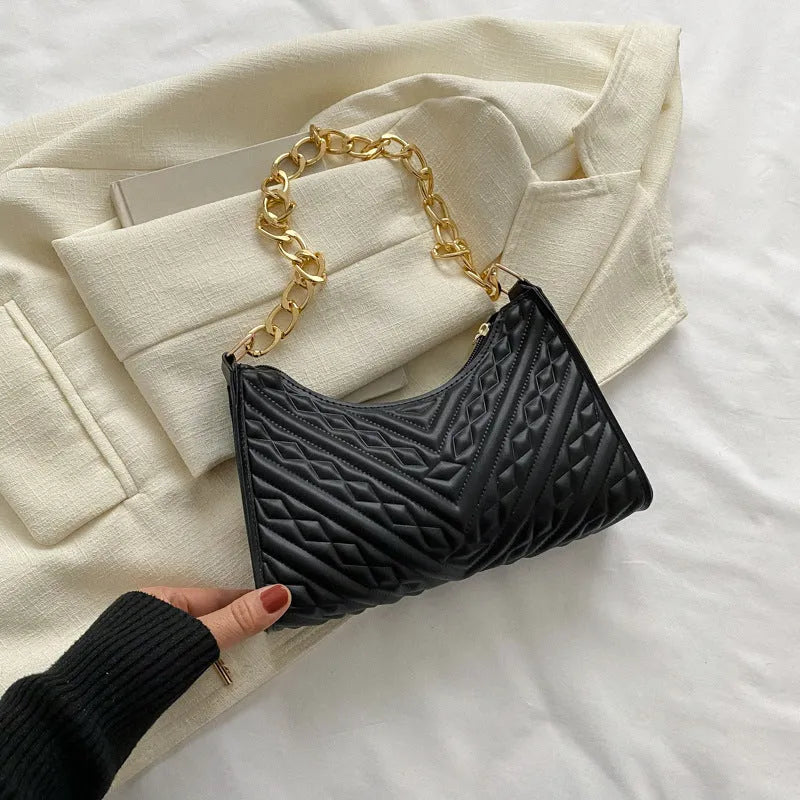 Brown pleated chain strap baguette shoulder bag with a vertical square shape and soft carry handle.