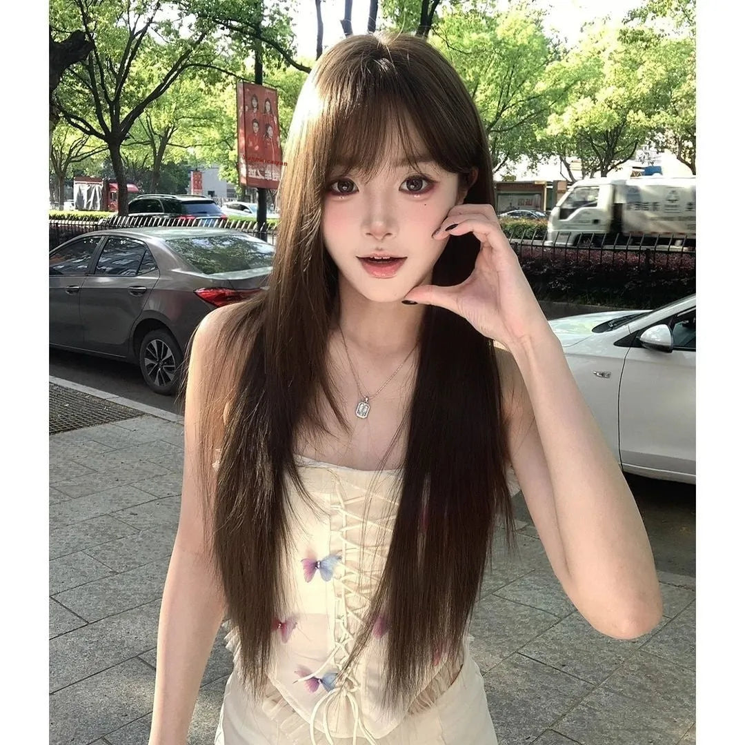 High-temperature fibre wig in Brown Black on wig stand with included care fluid and styling tools
