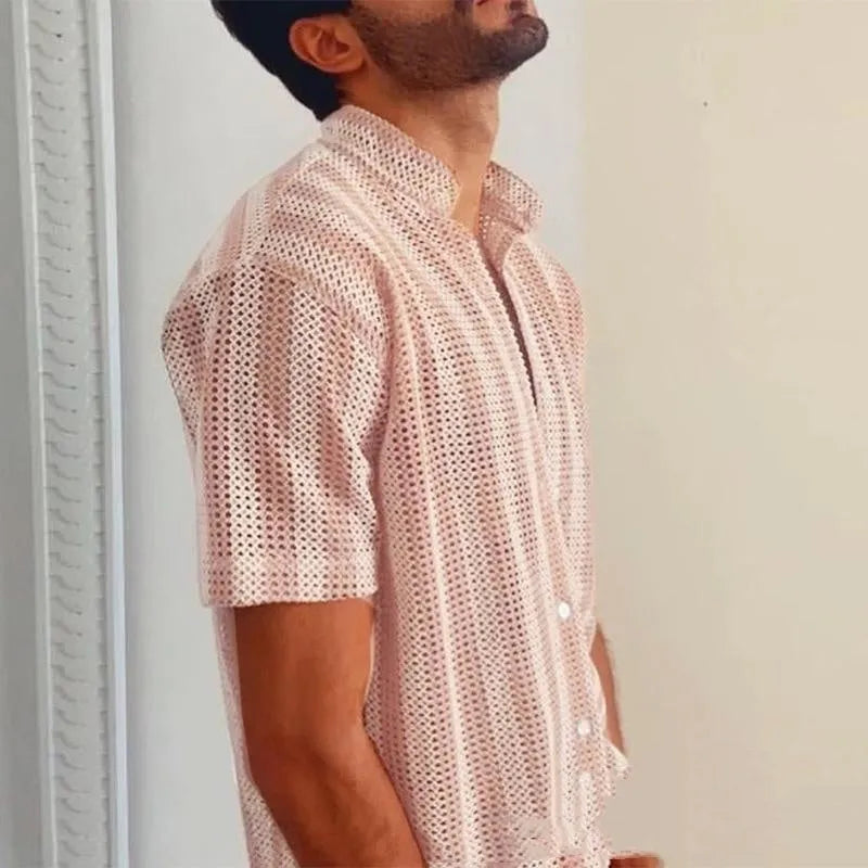 Pink men's loose-fit cardigan shirt with short sleeves and a waffle-textured fabric.
