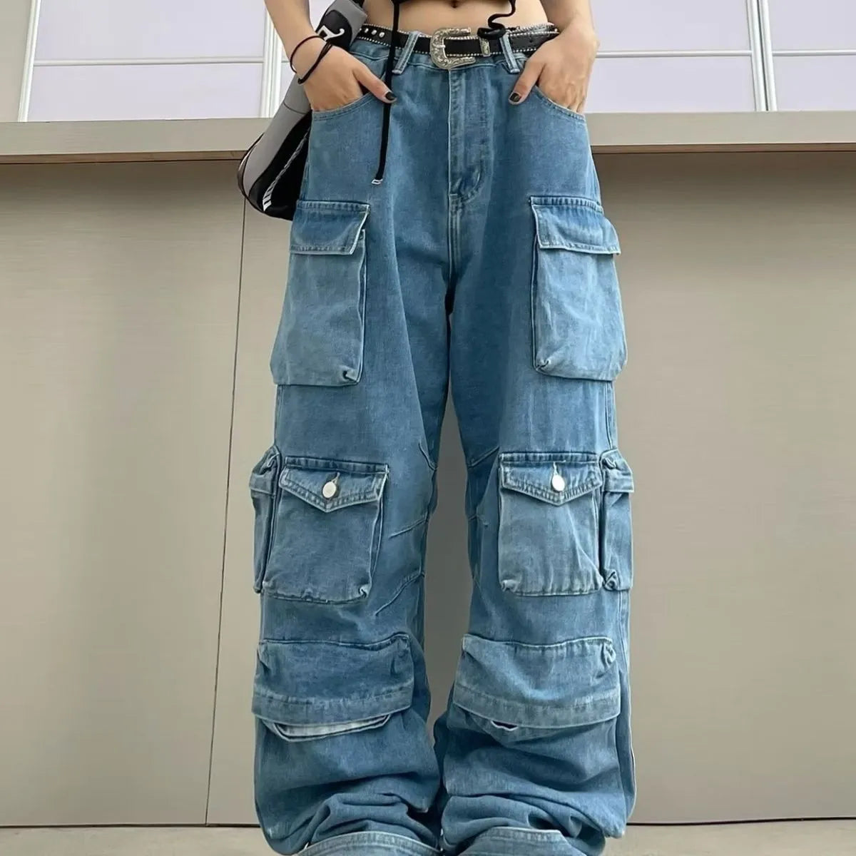 Women's high-waist wide-leg denim jeans with multiple pockets in tie-dyed blue street hipster style