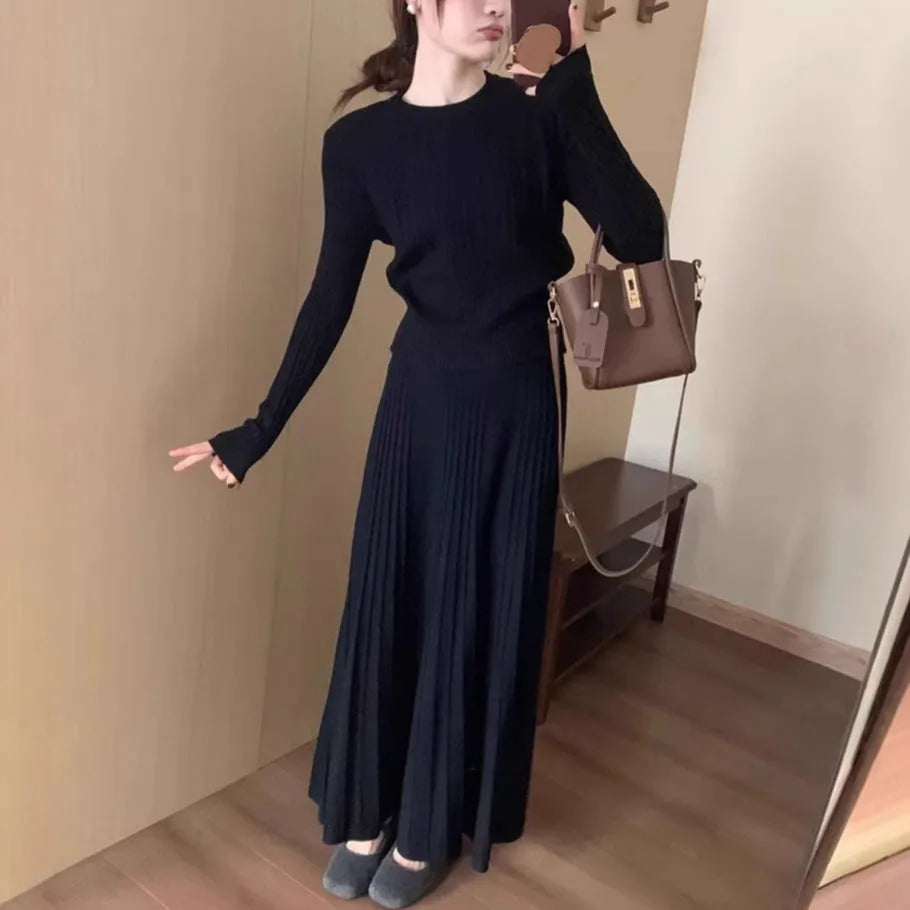 Dark grey knitted long dress suit with 3D texture, featuring a sweater and skirt in artistic retro style.