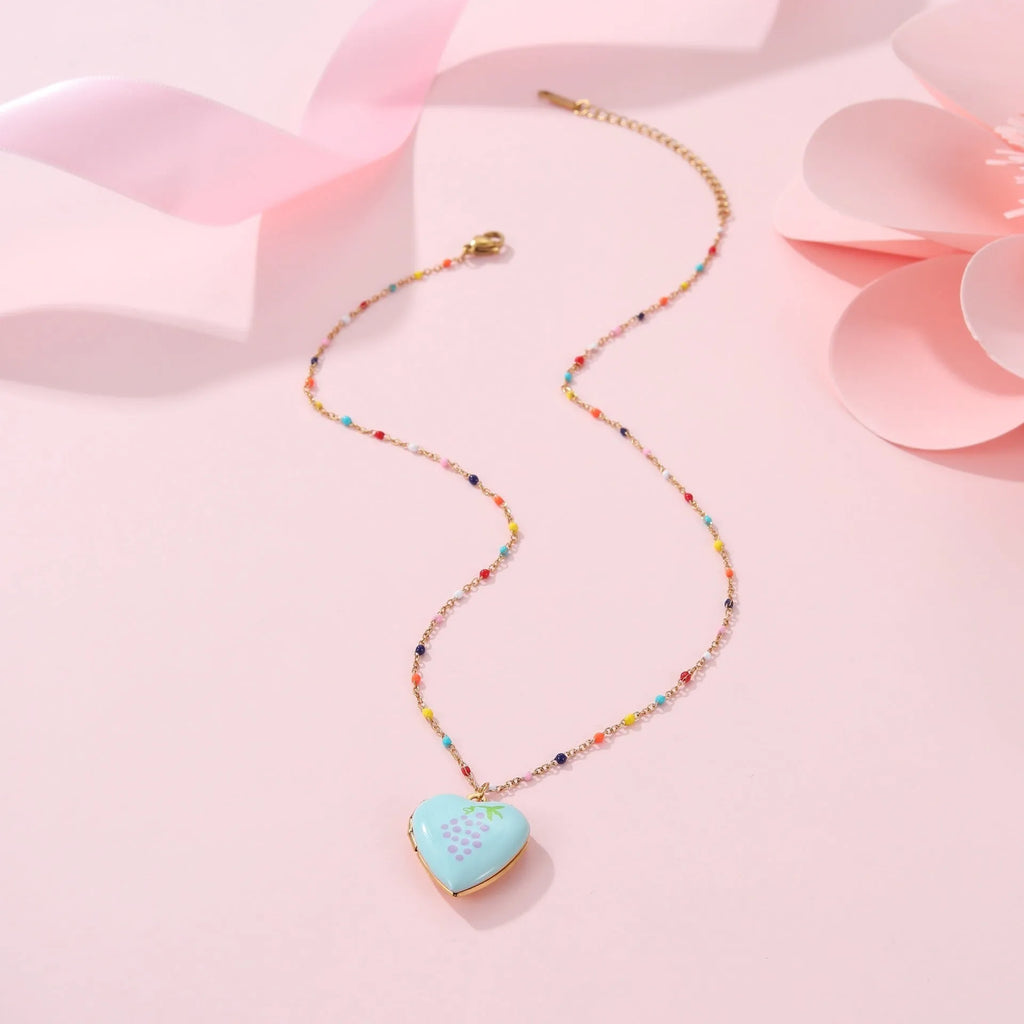Gold plated fruit charm necklace with heart-shaped pendant on adjustable stainless steel chain