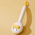 Small yellow duck-shaped pet comb with needle bristles for cat and dog grooming
