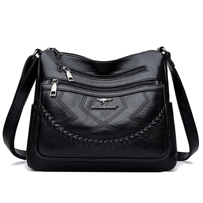Soft PU leather women's shoulder bag with crossbody strap in black colour