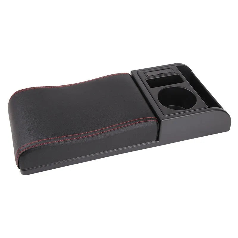 Universal automobile armrest box cover in black with red accent lines on car centre console