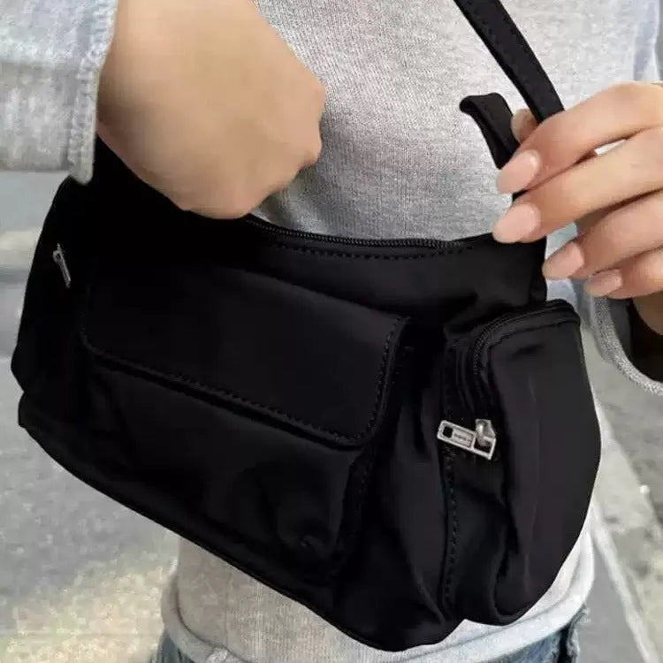 Black lightweight women's shoulder bag with double pockets and side line detail