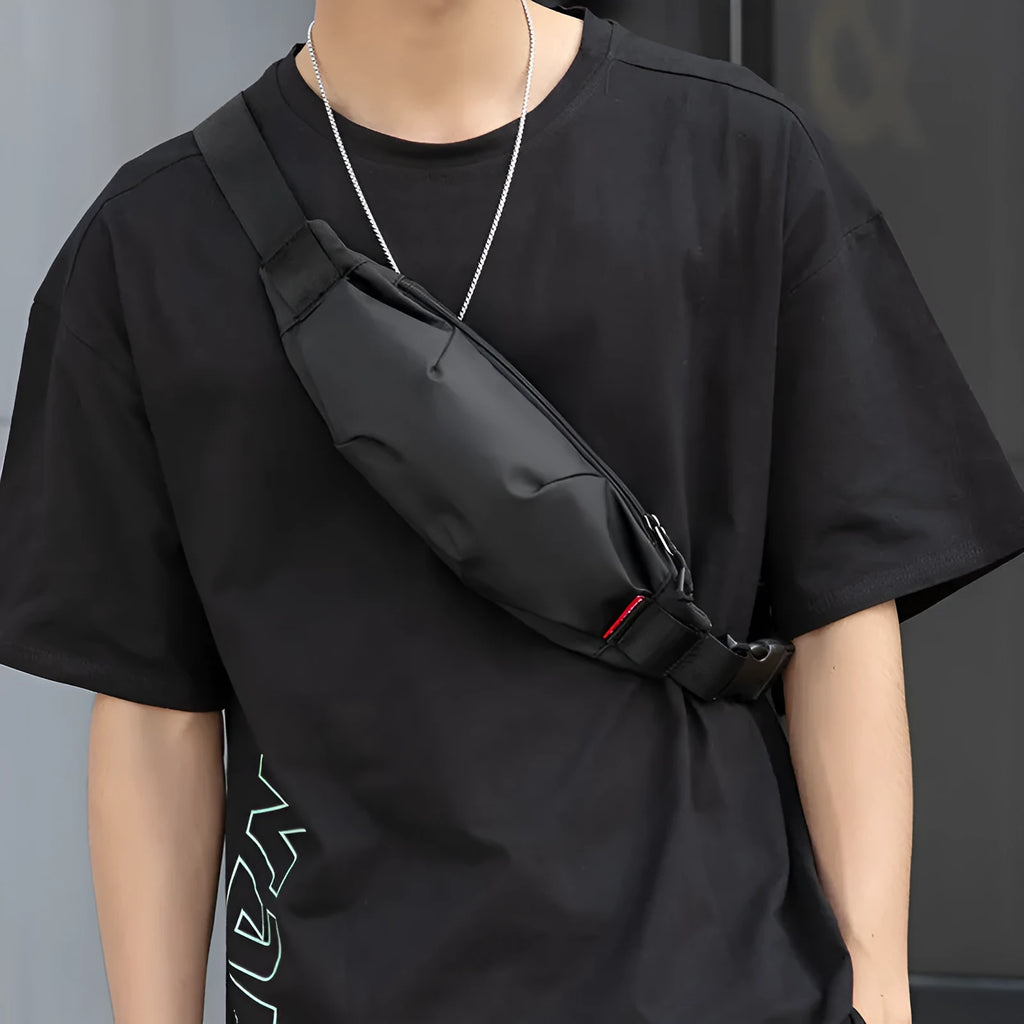 Black Oxford cloth waist pack with crossbody strap and zipper closure