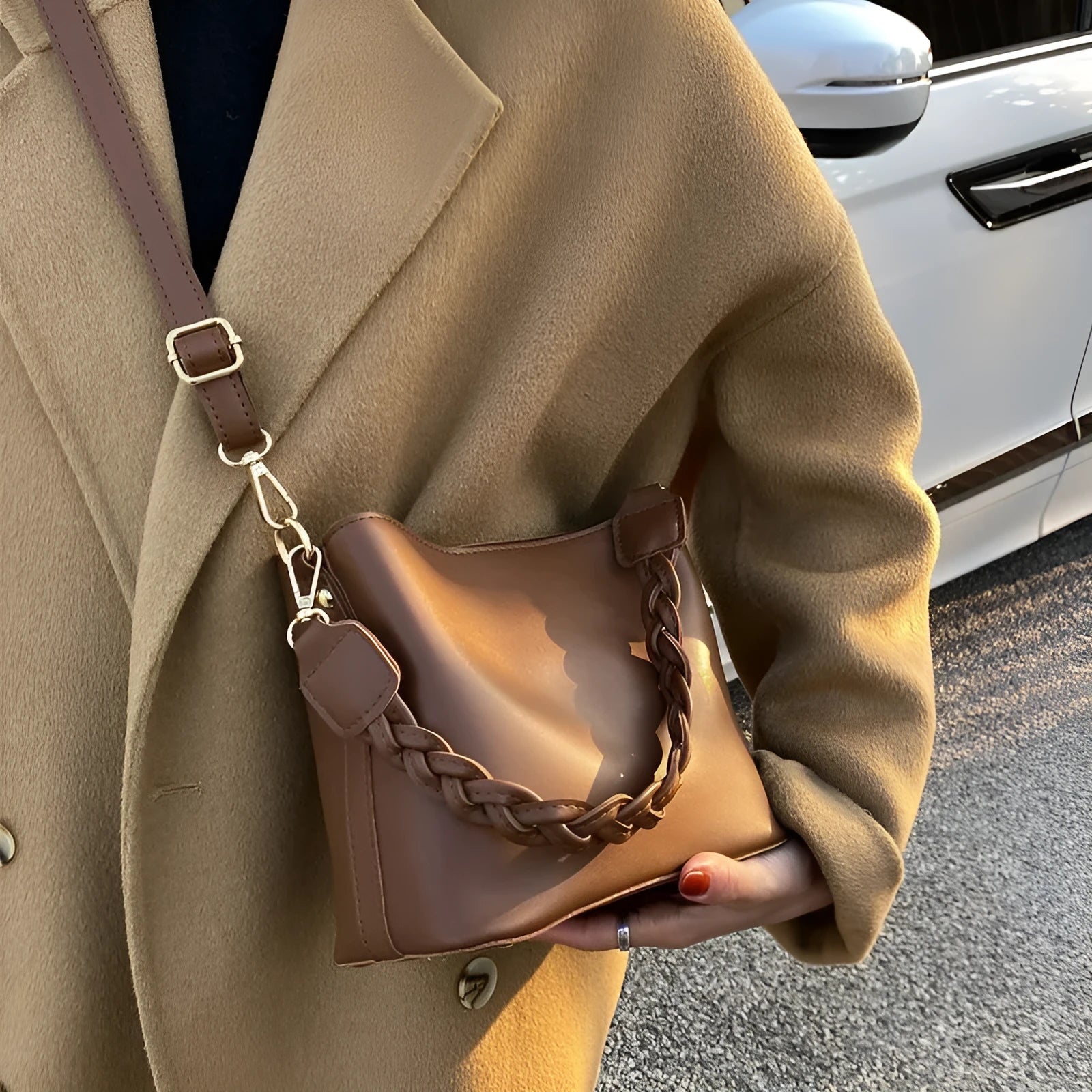 Retro woven PU leather crossbody bucket bag in khaki colour showing adjustable strap and bucket shape