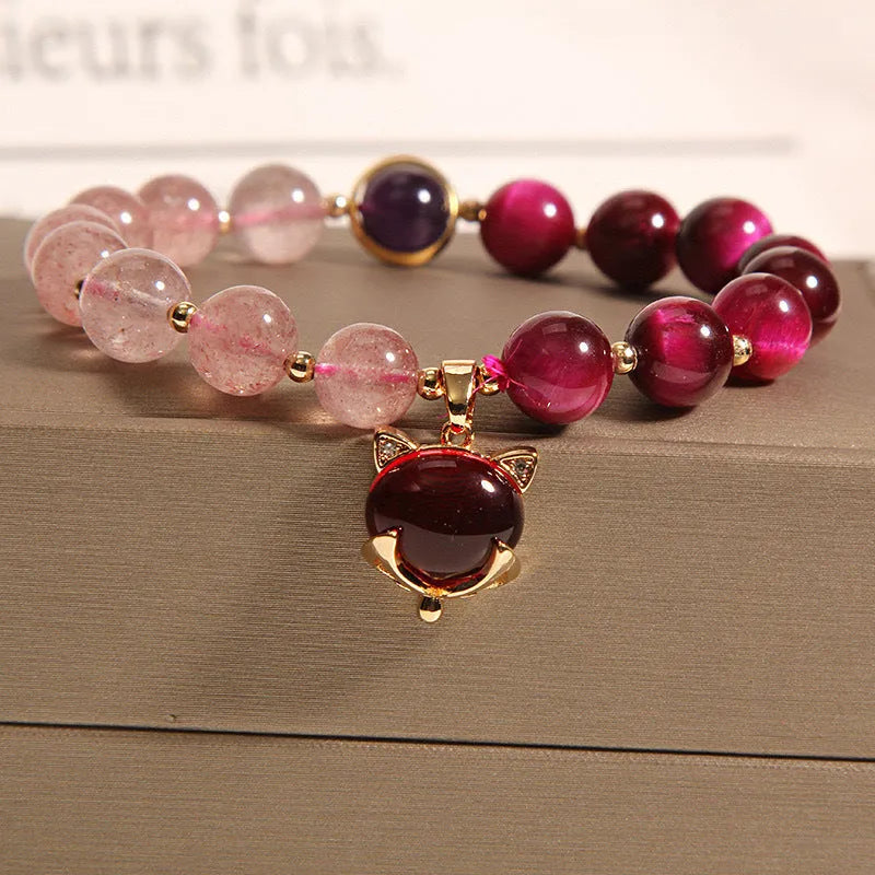 Simple strawberry crystal bracelet for women with elastic band, showing natural stone detail.