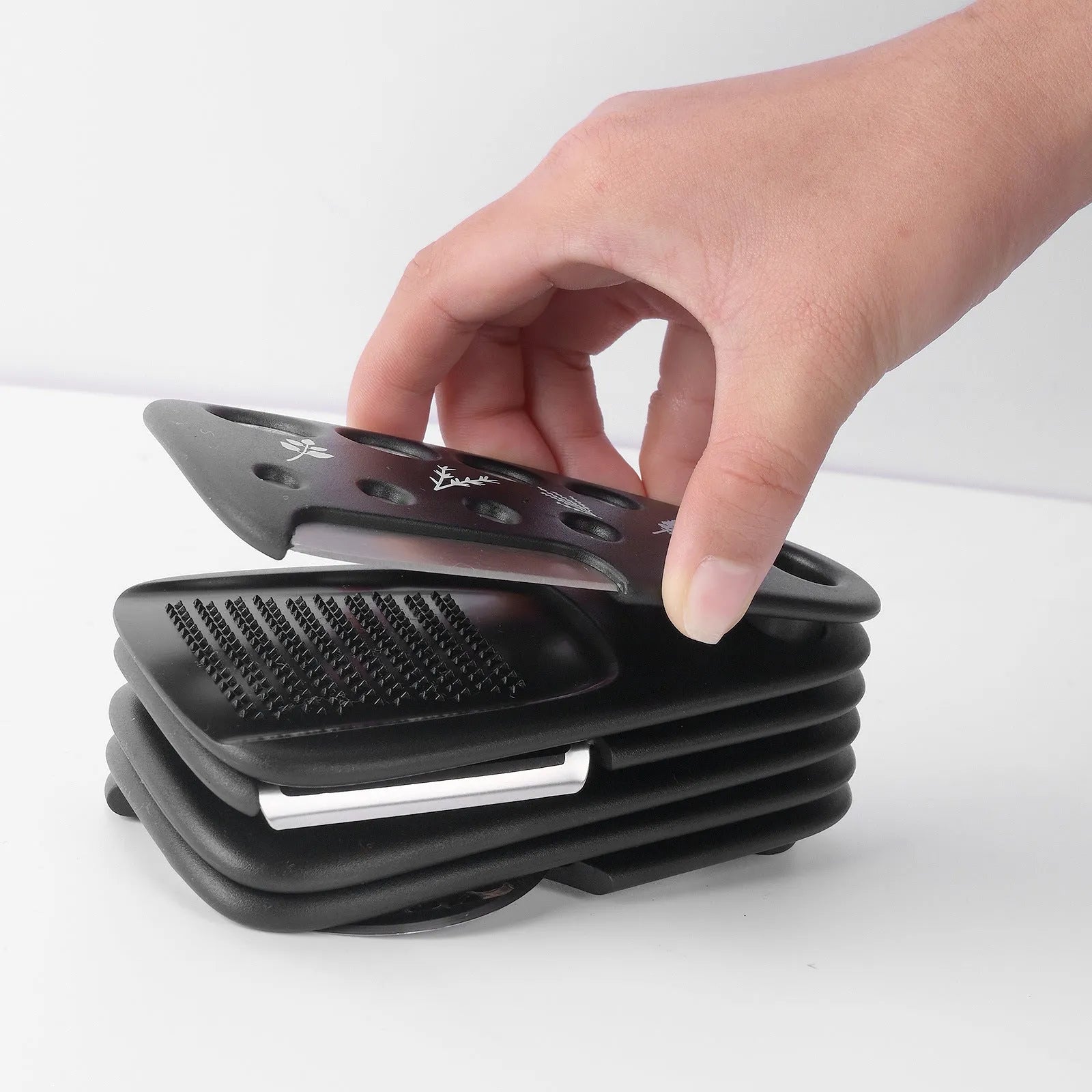Six stacking kitchen gadgets and a brush in a colour box, made from stainless steel and PP plastic
