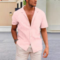 Men's apricot coloured corduroy short sleeve cardigan shirt on a hanger.