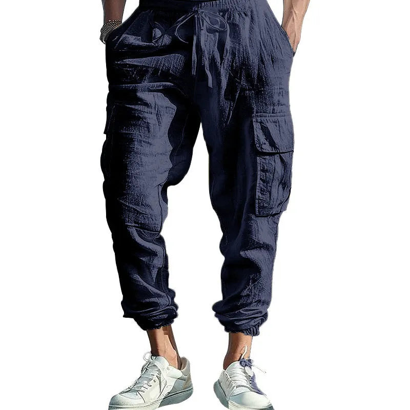 Men's linen casual trousers in Army Green with multi-pockets and an ankle tie closure.