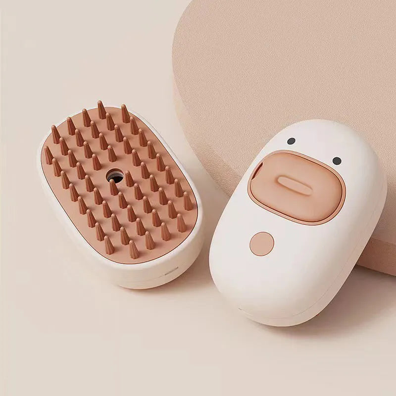 White and yellow rechargeable pet steam brush with rubber comb teeth and water tank.