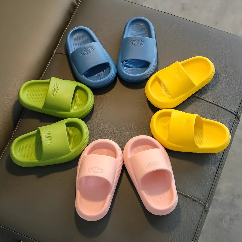 Children's EVA literal slippers with injection moulded soles in mixed colours showing non-slip wear-resistant design