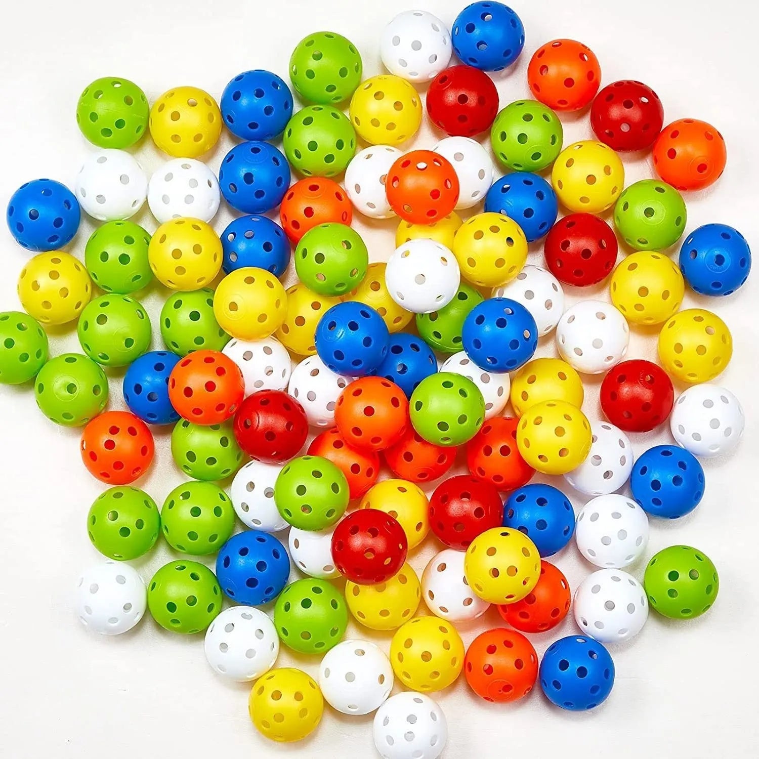Multi-colour golf practice balls in red, orange, blue, green, white, and yellow packed in a net bag.