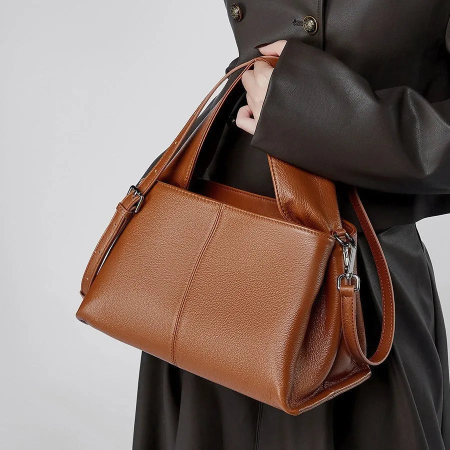 Women's apricot cowhide leather messenger bag with horizontal square shape and double shoulder straps