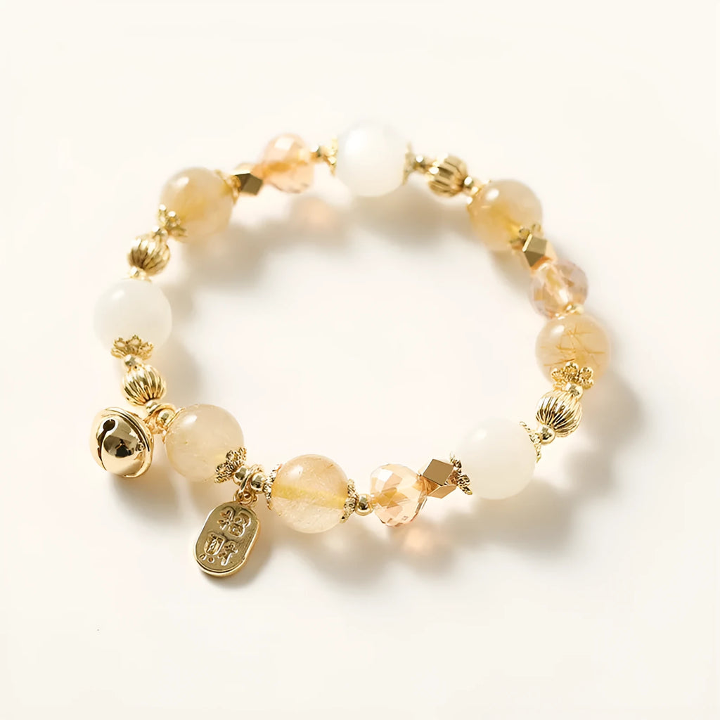 Gold rutilated quartz ringing bell bracelet with Korean style design and electroplated crystal construction