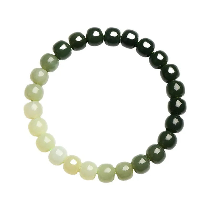 Natural Hetian jade bracelet with water gradient colour on a wrist.