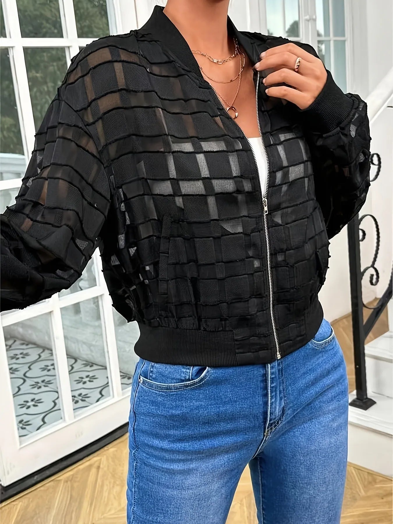 Black women's casual jacket with geometric pattern and semi-transparent thread zipper.